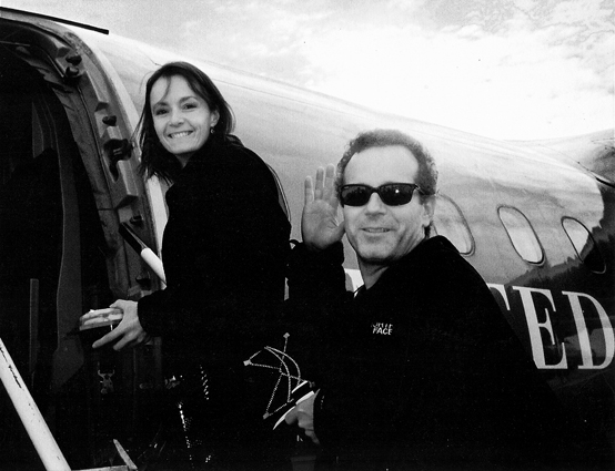 Photo of Becky and Jeffrey Aaronson getting on a plane