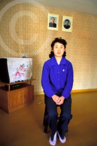 Photo of a typical North Korean home with portraits of Kim il Sung and Kim Jong Il